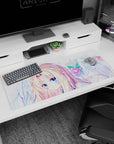36x16 inches anime mouse pad showing a wistful blonde angel girl framed by feathery wings and petals.