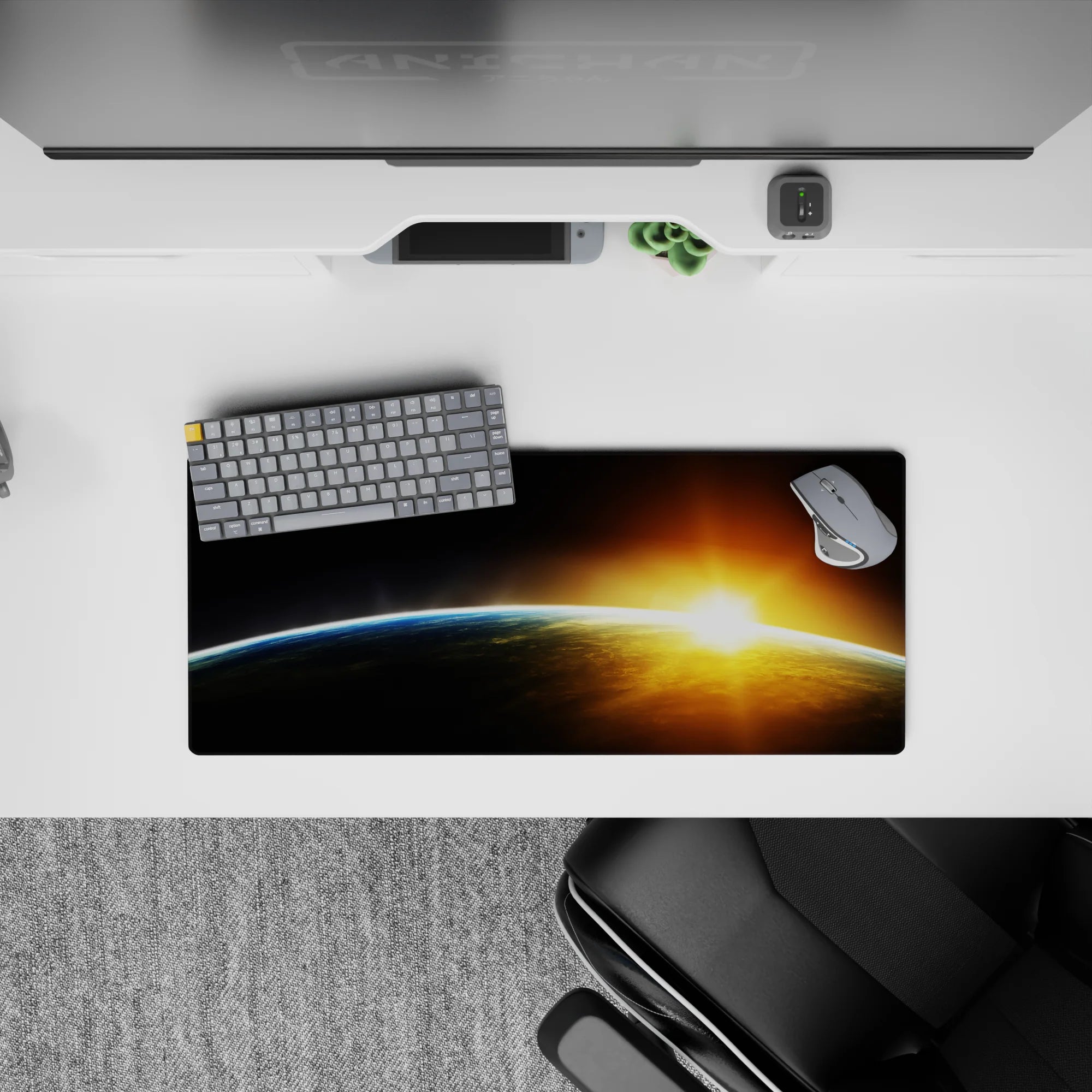 Dreamy calming mouse pad 28x12 inches in deep blacks, smoky grays, sharp blue edge, gold amber burst.