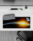 Dreamy calming mouse pad 28x12 inches in deep blacks, smoky grays, sharp blue edge, gold amber burst.