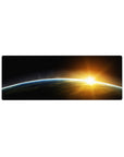 Cosmic horizon desk mouse pad, 32x12 inches, with midnight fade, blue rim, and sunrise glow.