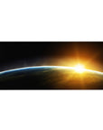 Cosmic horizon desk pad 36x16 inches with curved blue rim and sunrise burst over smoky gradient.