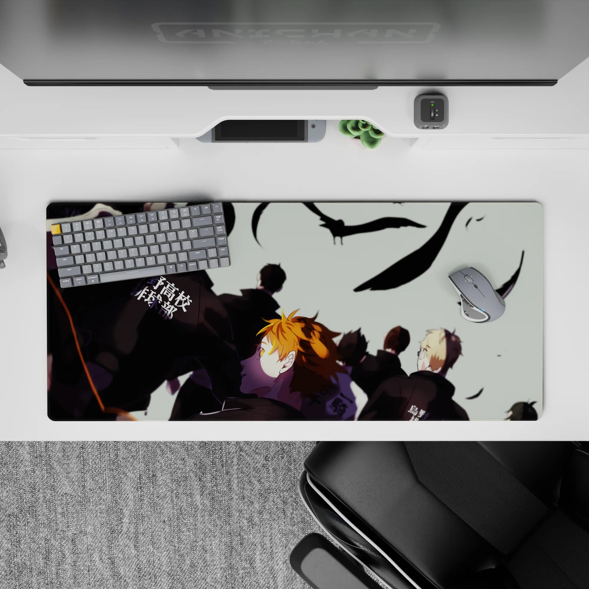 Moody orange-and-black anime desk pad 36x16 inches with pale sky, black feathers, and pre-match tension.