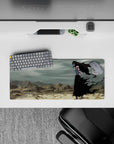 Ichigo Kurosaki in Hollow form from Bleach on 28x12 inch mouse pad; stormy wasteland backdrop with intense red eyes.