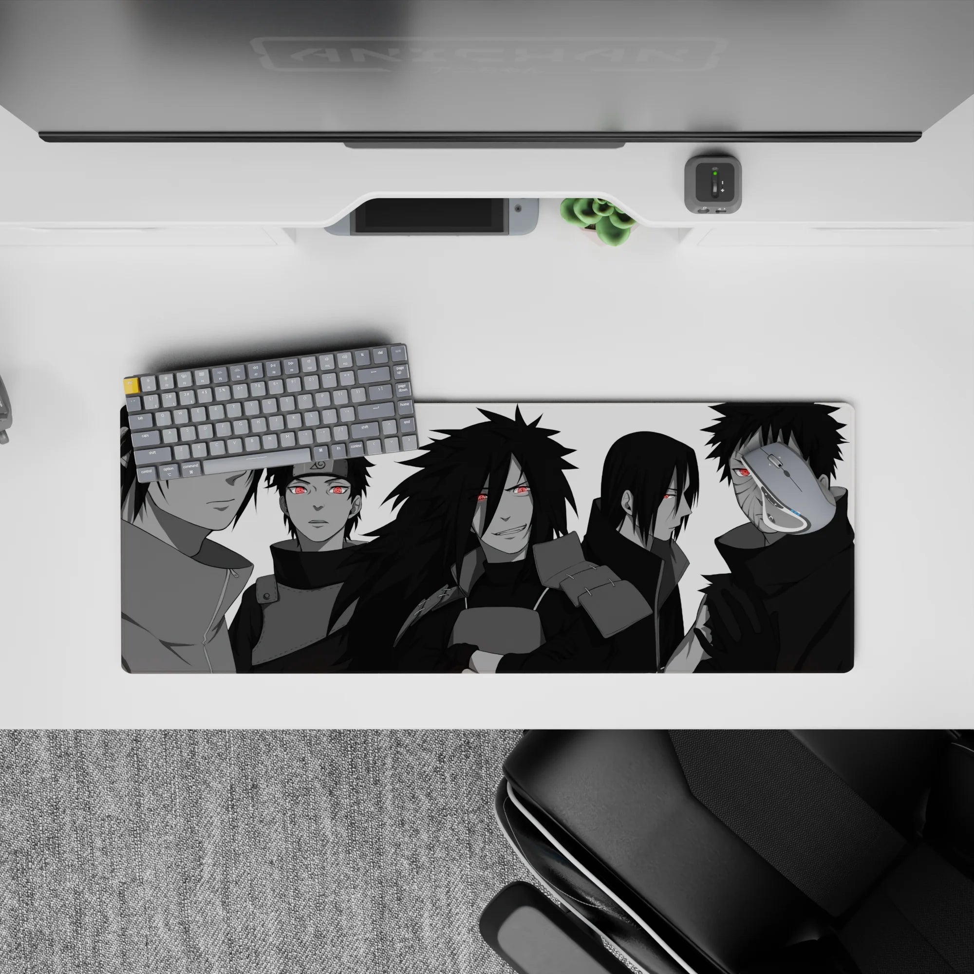 32x12 inches anime mouse pad in moody grayscale with red Sharingan pops and a purple Rinnegan.