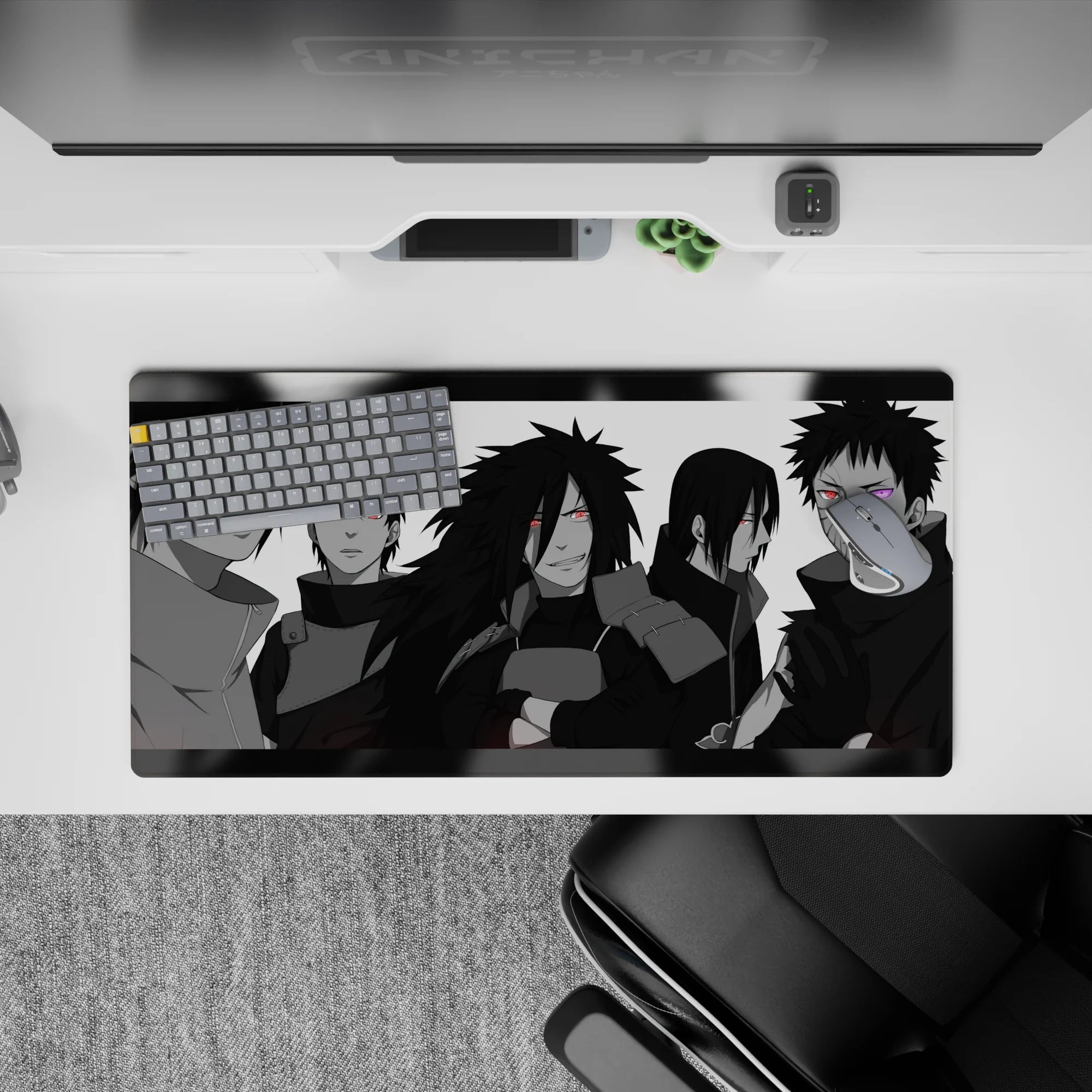 32x16 inches anime mouse pad in sleek grayscale with red Sharingan eyes and a purple Rinnegan pop.