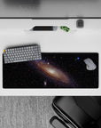 Deep black 32x12 inches mouse pad with creamy glow, wispy blues, violet haze, and amber star sparks.