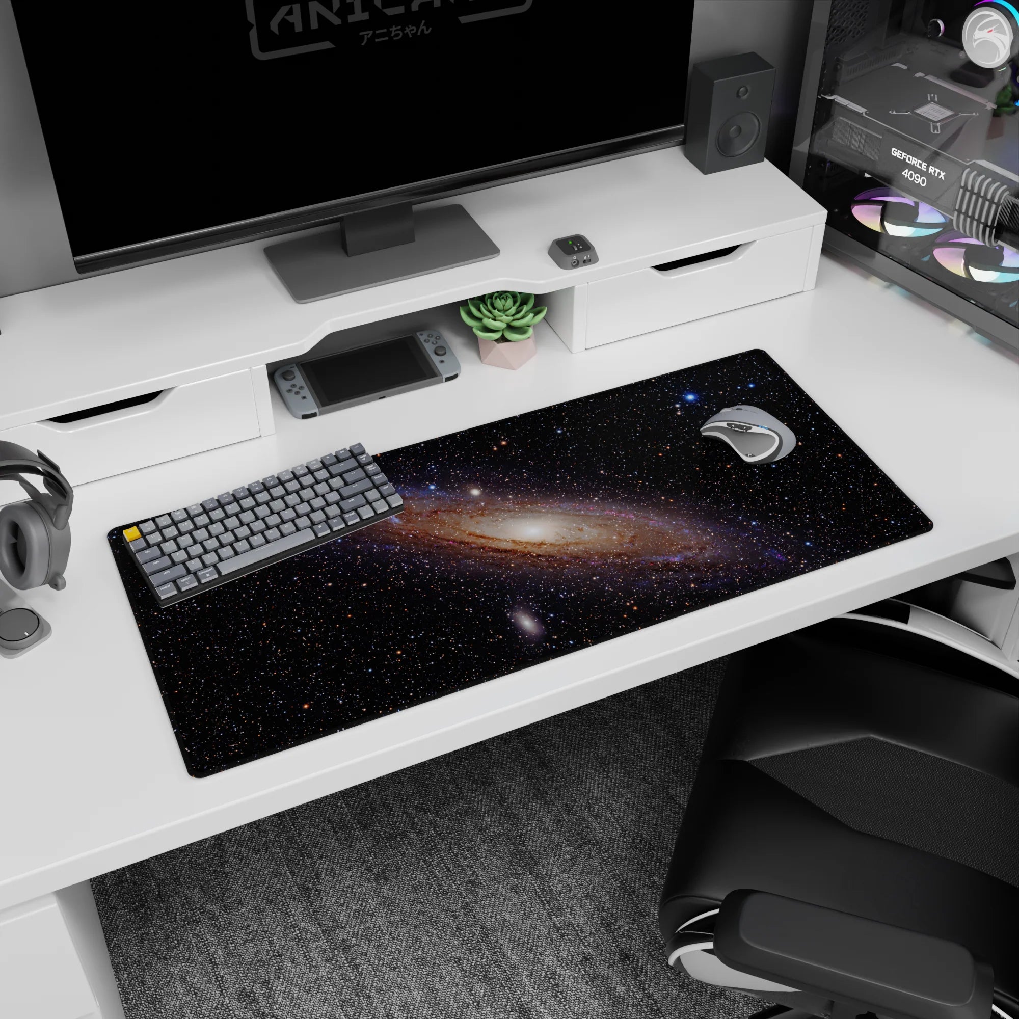 Dreamy space scene desk pad 36x16 inches showing a swirling galaxy with dusted stars and soft glow.
