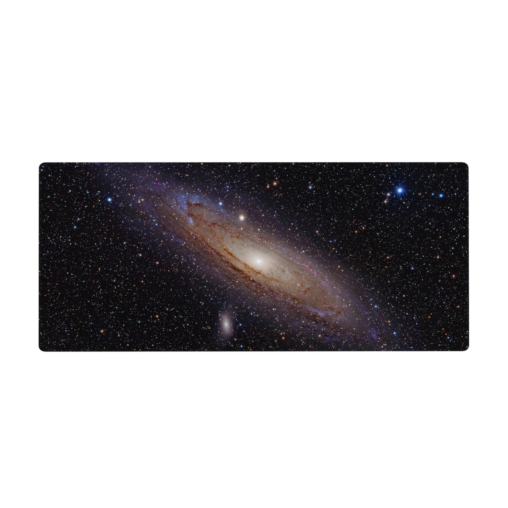 Spiral galaxy starfield desk pad 36x16 inches with glowing creamy core on deep black space.