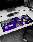 Mau perched in sleek black outfit and thigh-highs with oversized scarf on an anime desk pad 36x16 inches.