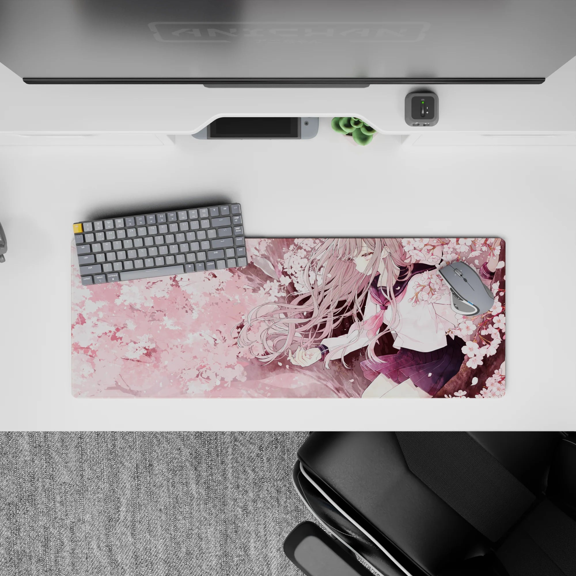32x12 inches anime girl desk mat in blush pink and navy tones, cozy sakura highlights, calm vibe.
