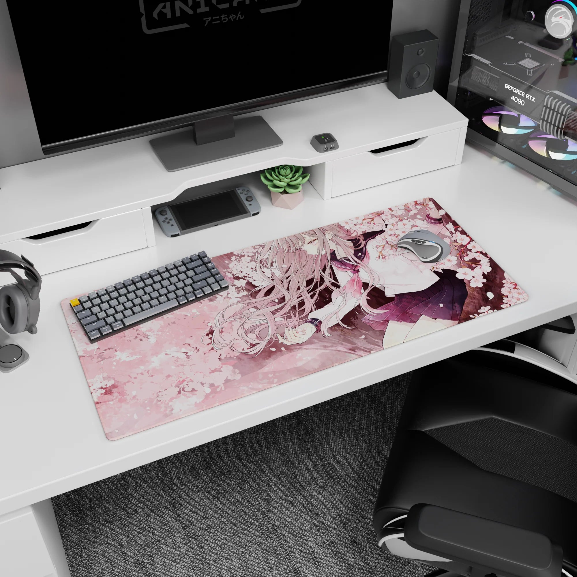 Anime schoolgirl desk pad 36x16 inches, silver hair ribbons, navy pleated skirt, rosy tie amid blossoms.