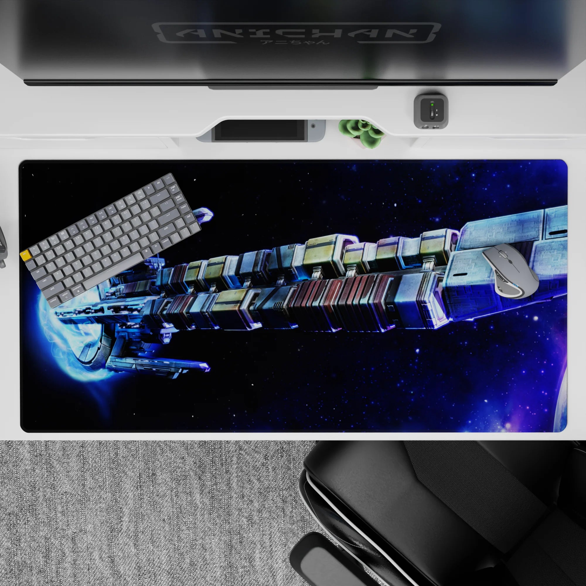 Large 40x20 inch desk pad featuring a swirling starry galaxy design with deep blues and vibrant neon accents.