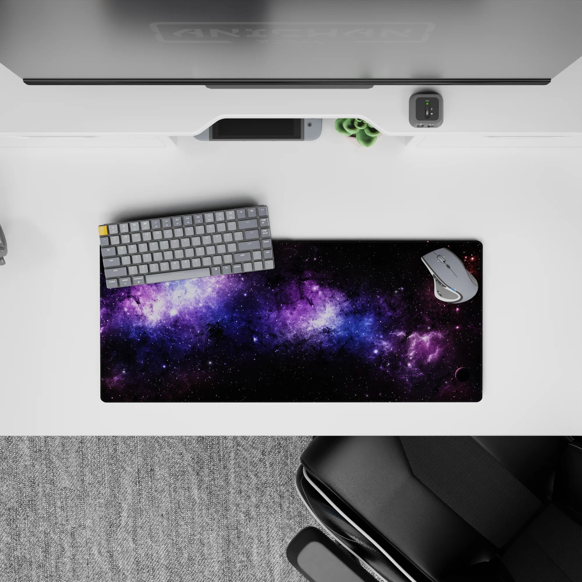 Galaxy inspired desk mouse pad with black, violet, and blue nebula design, 28x12 inches large surface.