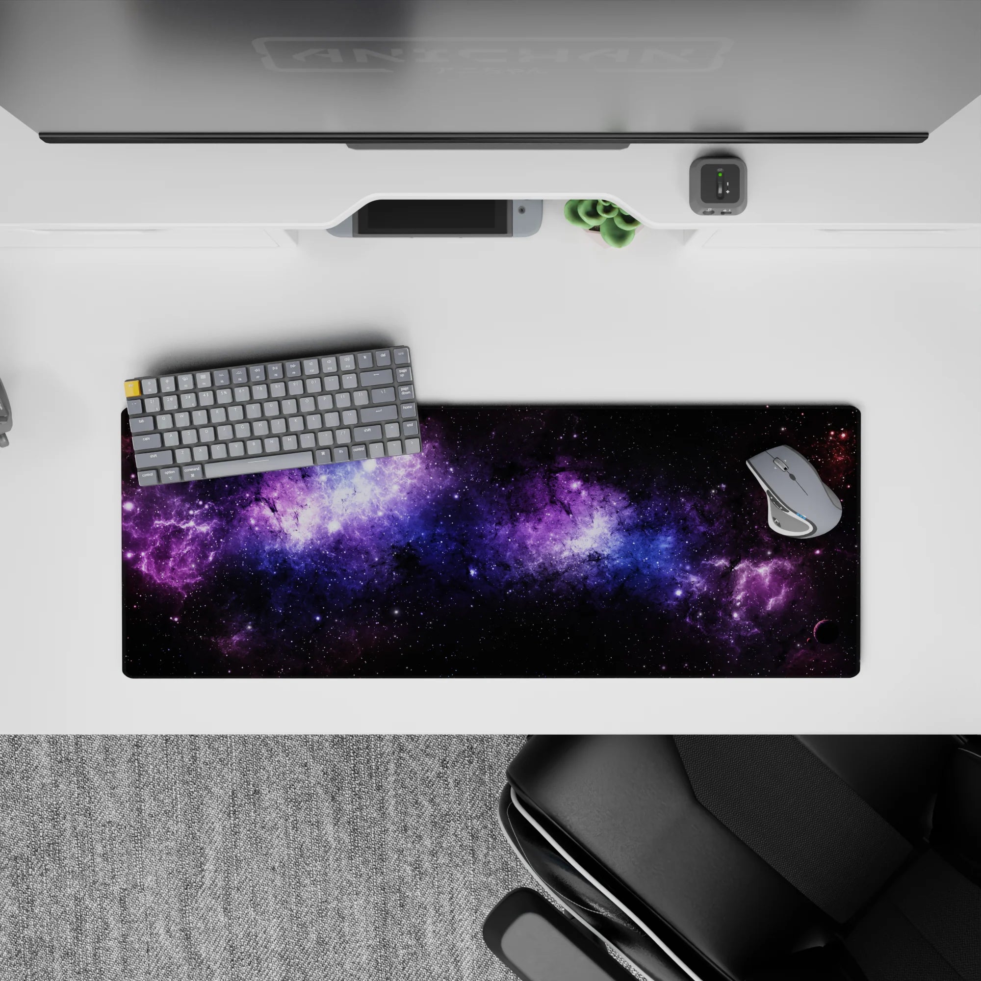 Large 32x12 inch mouse pad featuring deep space design with violet nebula, blue stardust, and starry night hues.