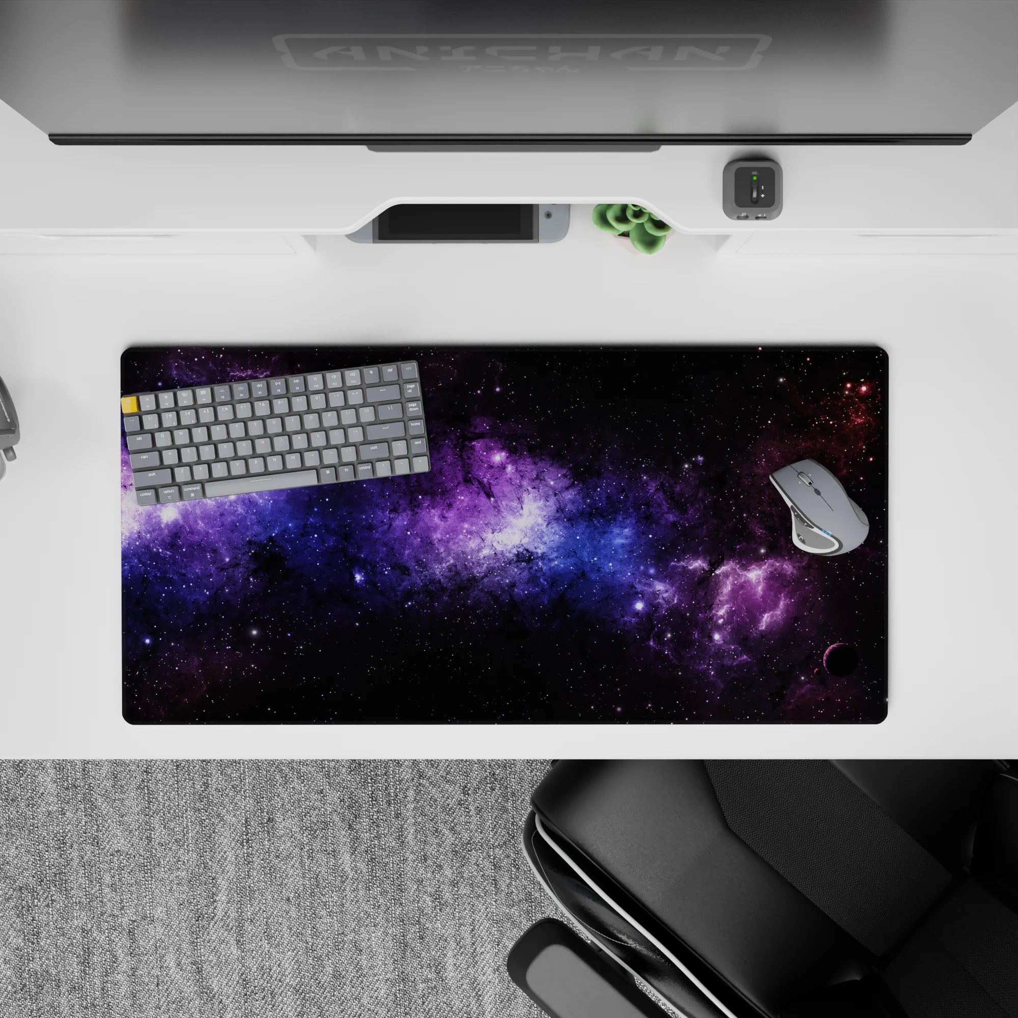 Cosmic desk mouse pad 32x16 inches featuring black nebula clouds, violet haze, and soft blue stardust design.