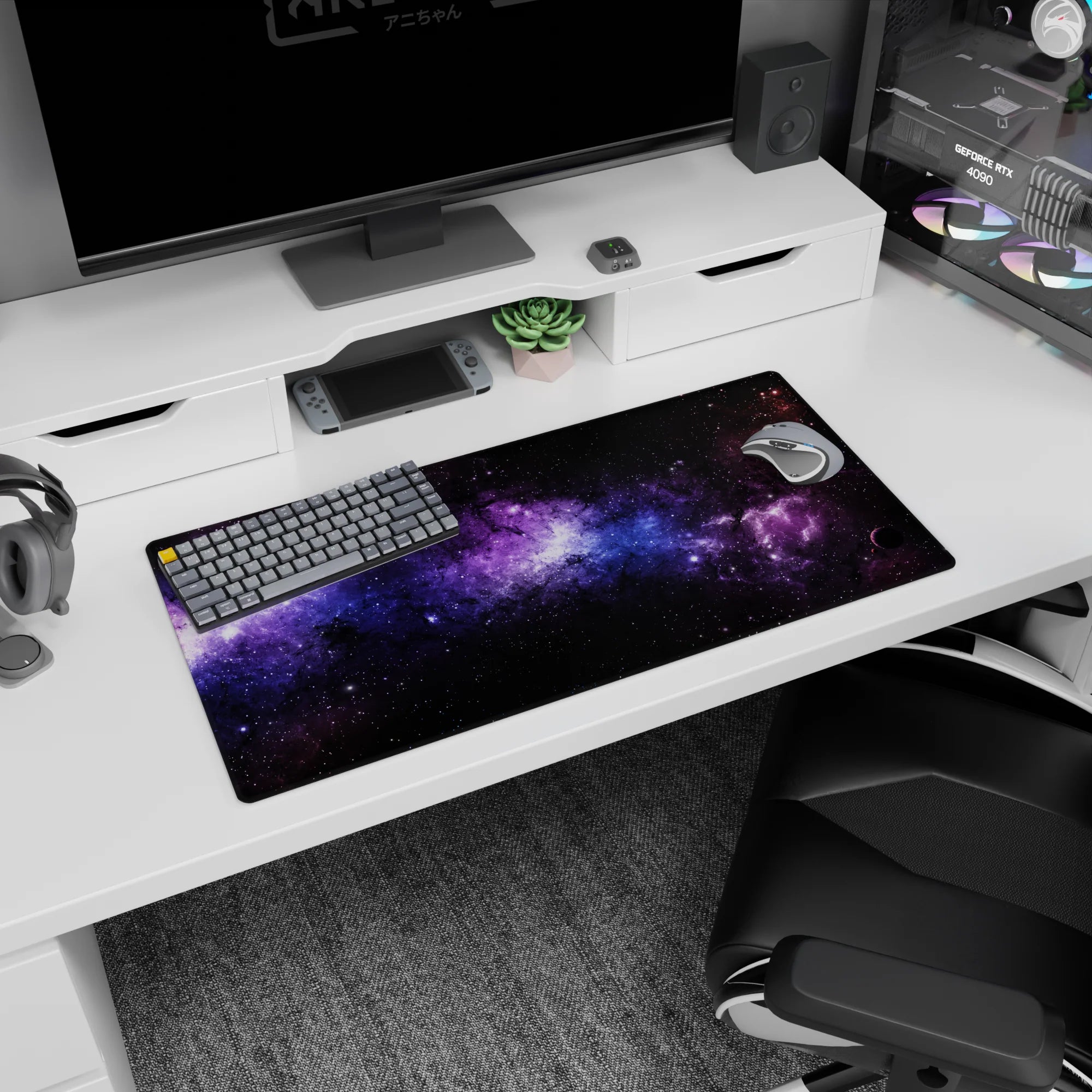 Galaxy inspired desk mouse pad with black, violet, and blue nebula design, size 32x16 inches.