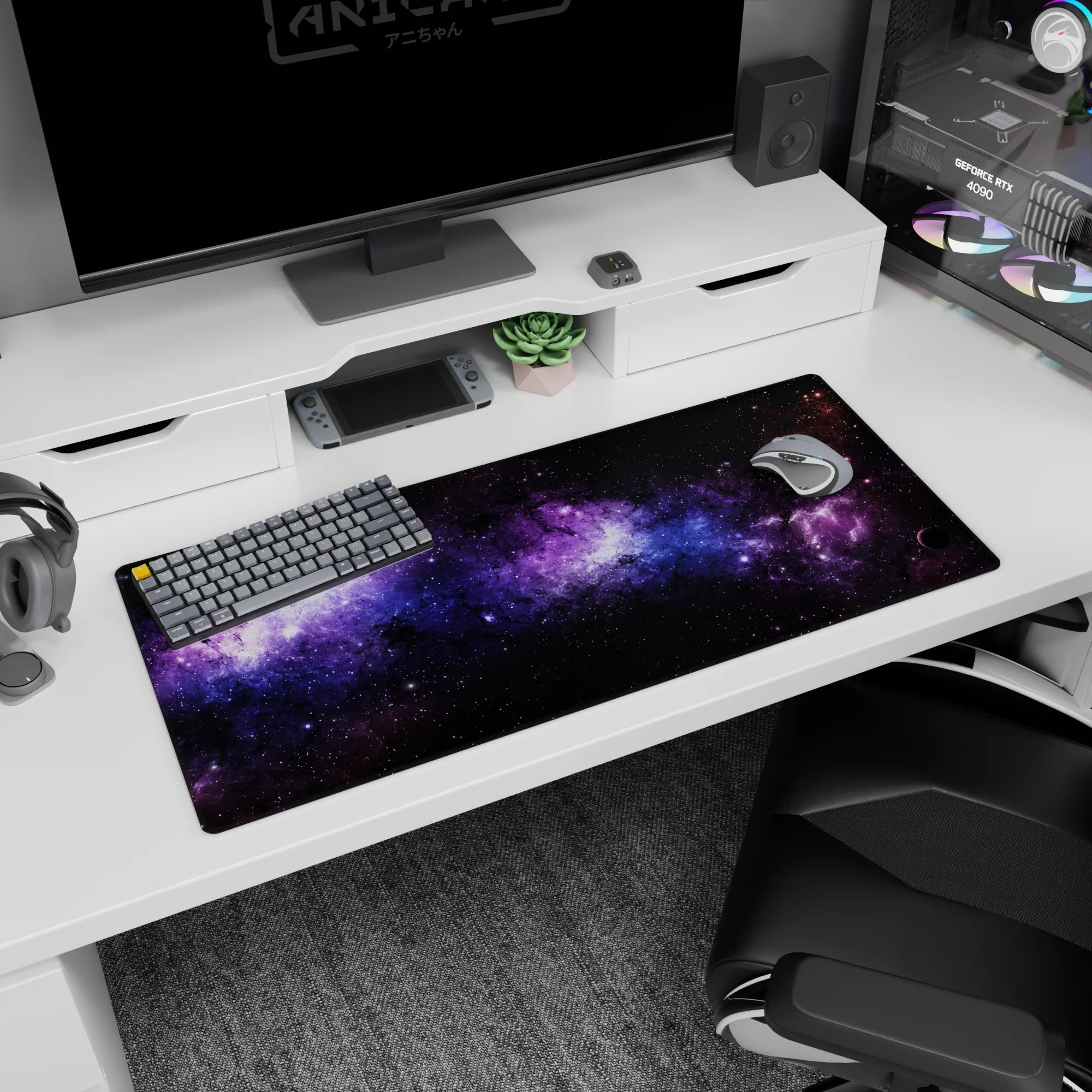 Galaxy-themed desk pad 36x16 inches featuring black nebula clouds, violet haze, and soft blue stardust design.