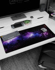 Galaxy-themed desk pad 36x16 inches featuring black nebula clouds, violet haze, and soft blue stardust design.