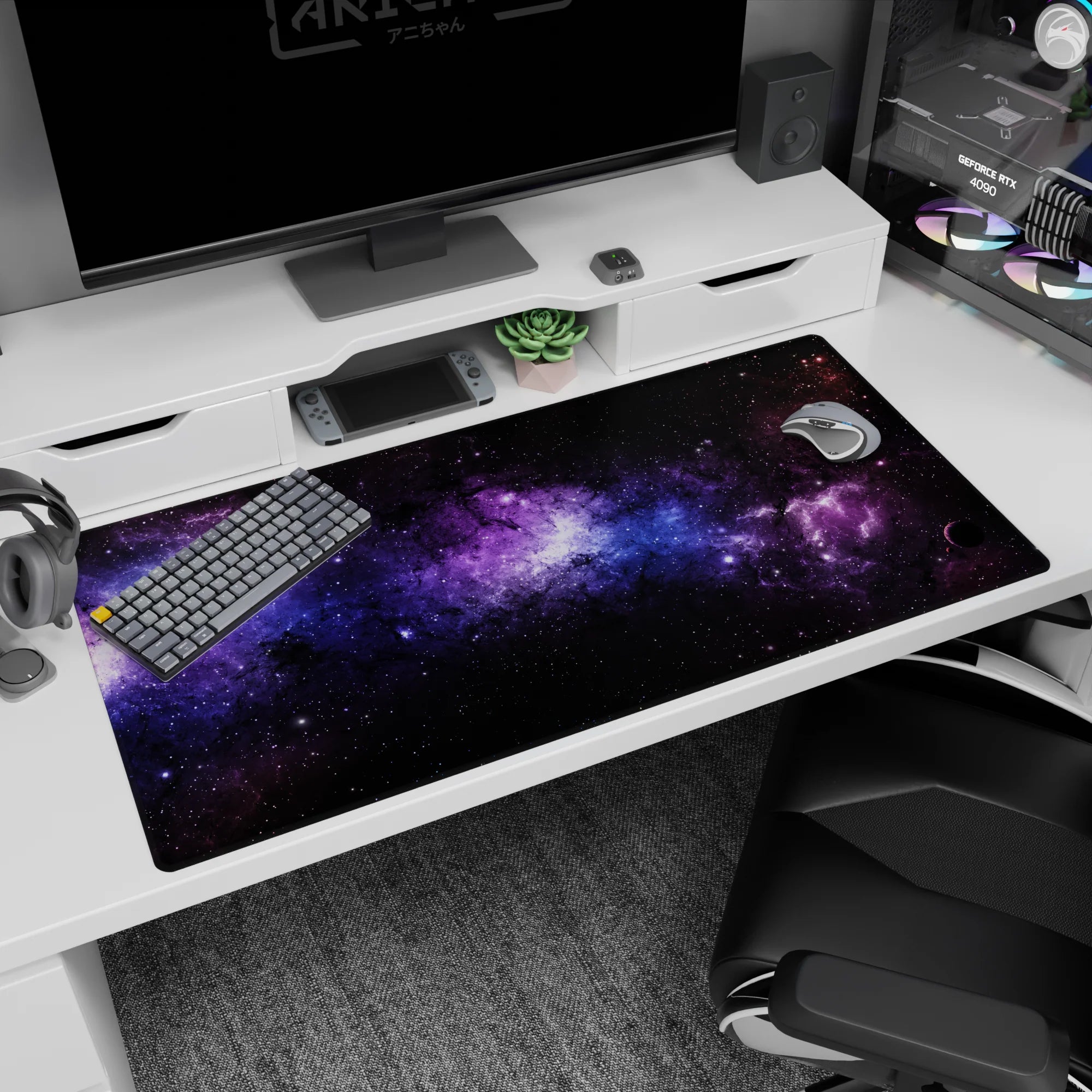 Galaxy-themed desk pad 40x20 inches with swirling violet nebula clouds, soft blue stardust, and scattered tiny stars.