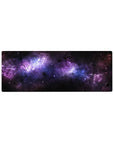 Cosmic galaxy desk mouse pad 32x12 inches with swirling black, violet, and blue nebula design.