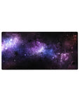 Galaxy-themed desk mouse pad with black, violet, and blue nebula pattern, size 32x16 inches.