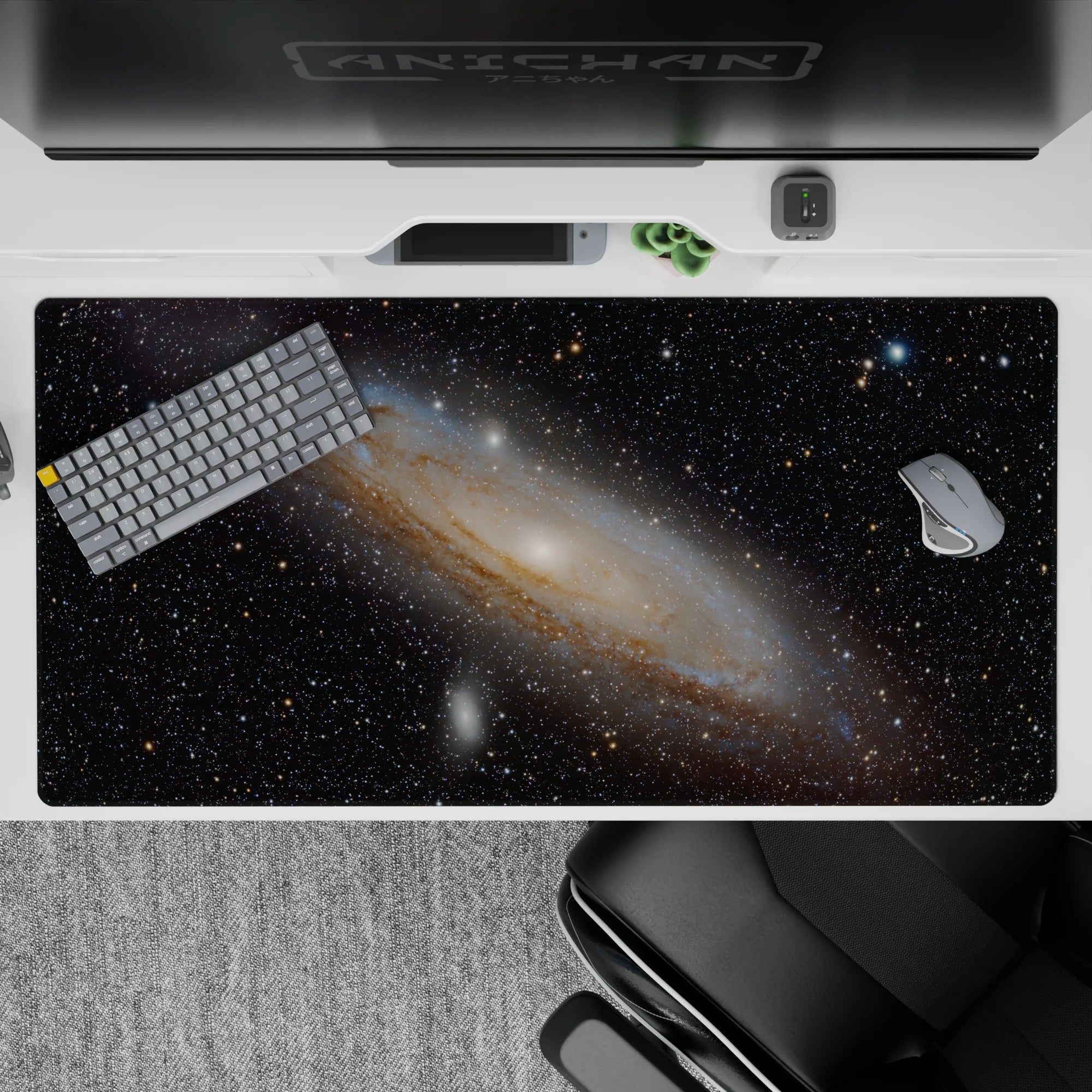 Galaxy-themed desk pad 40x20 inches with spiral nebula design, smooth surface for precise mouse control and stylish setup.