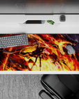 High-contrast orange, gold, and crimson anime desk pad 36x16 inches, fiery sparks and action vibe.