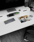 Shy-but-bold anime schoolgirl leaning by a phone, crisp white blouse and dark skirt, mouse pad 14x10 inches.