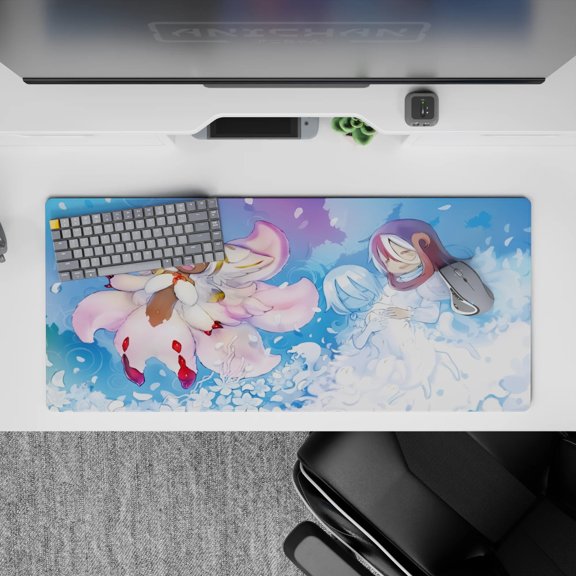 36x16 inches anime desk pad in dreamy blues and blush pink, serene misty glow with swirling petals.