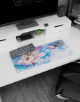 28x12 inches anime mouse pad showing hooded figure cradling pale blue-haired companion beside fluffy fox spirit.