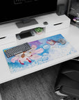 32x16 inches anime mouse pad showing hooded figure cradling pale blue-haired companion beside fluffy fox spirit.