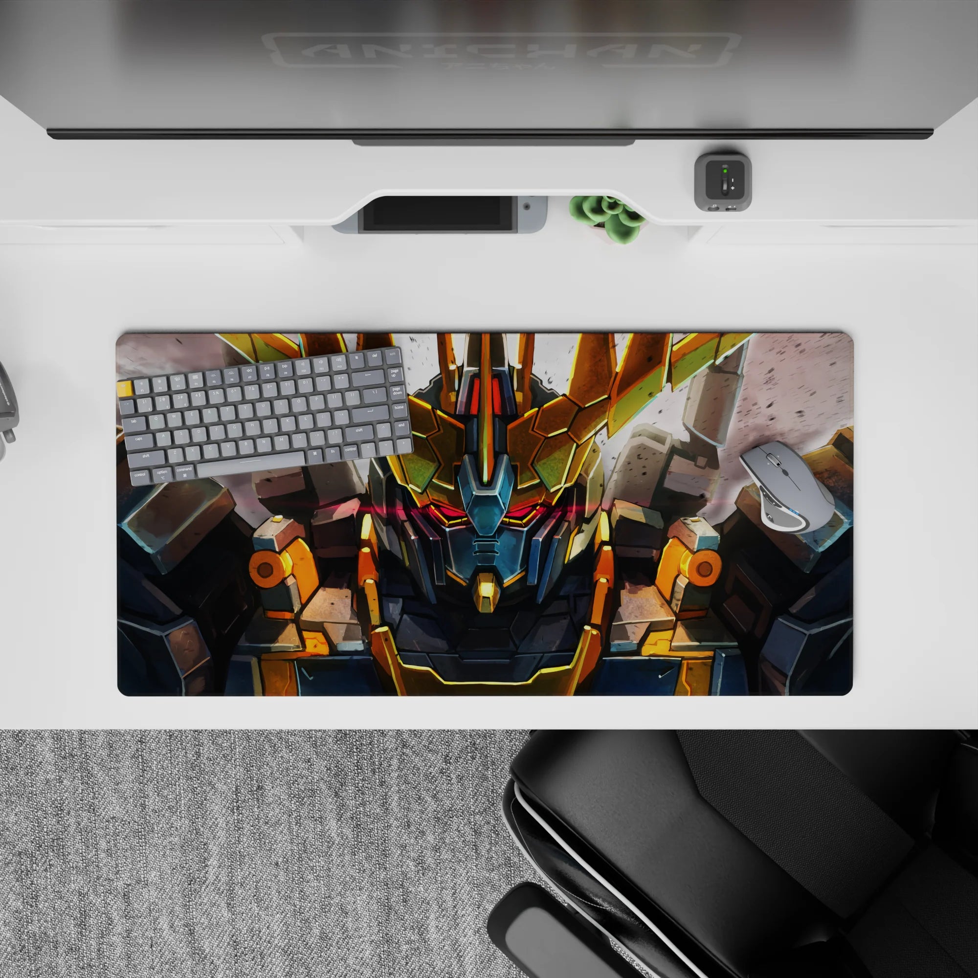 32x16 inches anime mouse pad in steel gray with gold V-fin and red visor glow, intense mood.