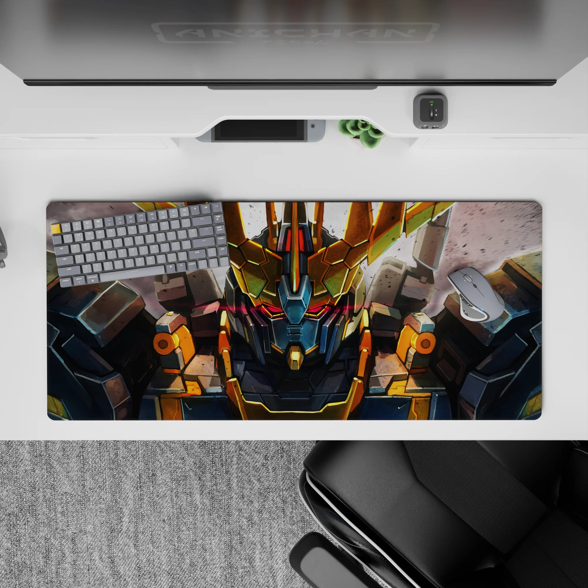36x16 inches anime mouse pad in steel gray with gold V-fin and a red visor glow, intense mood.
