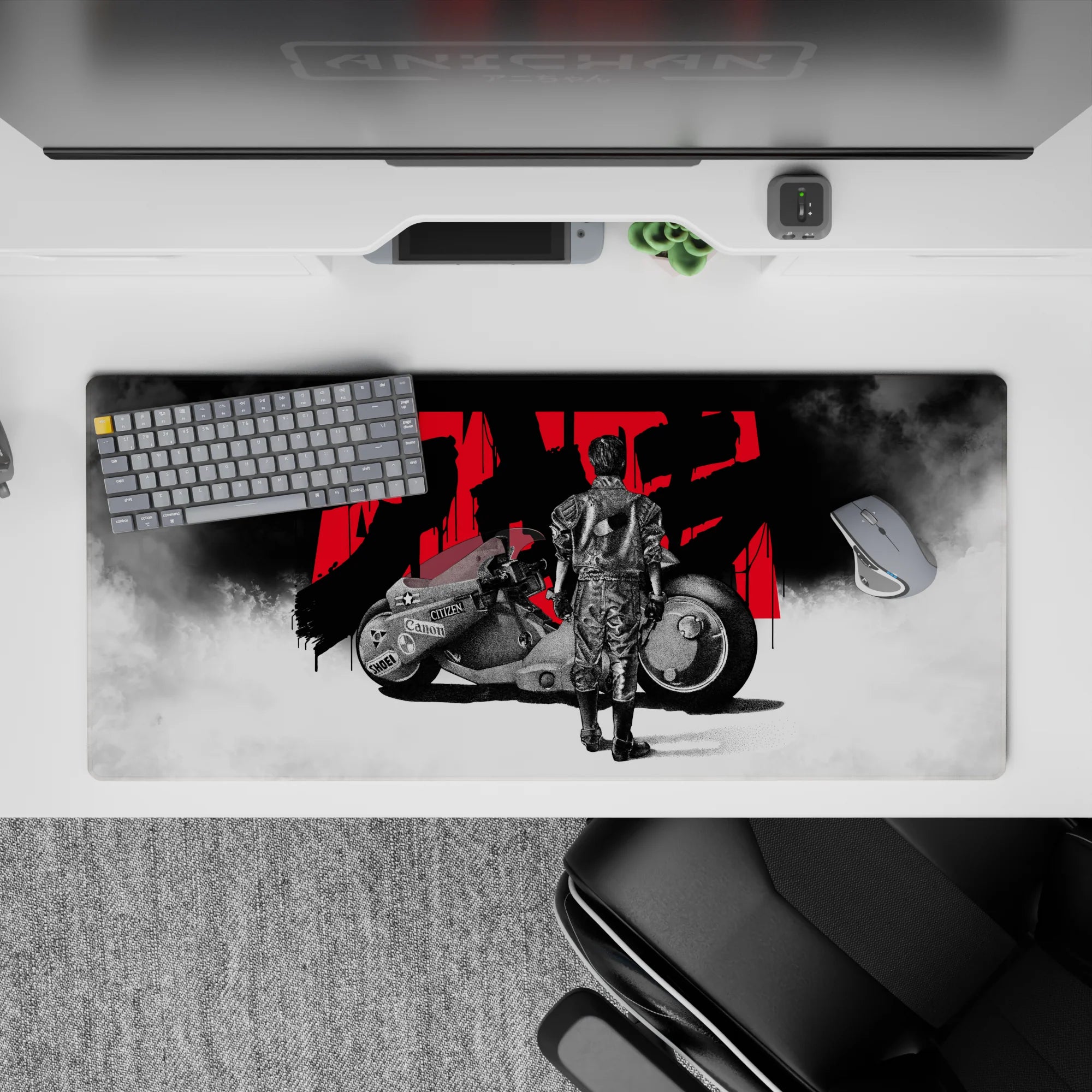 36x16 inches anime desk pad in stark black-and-white with bold red kanji, quiet pre-race mood.