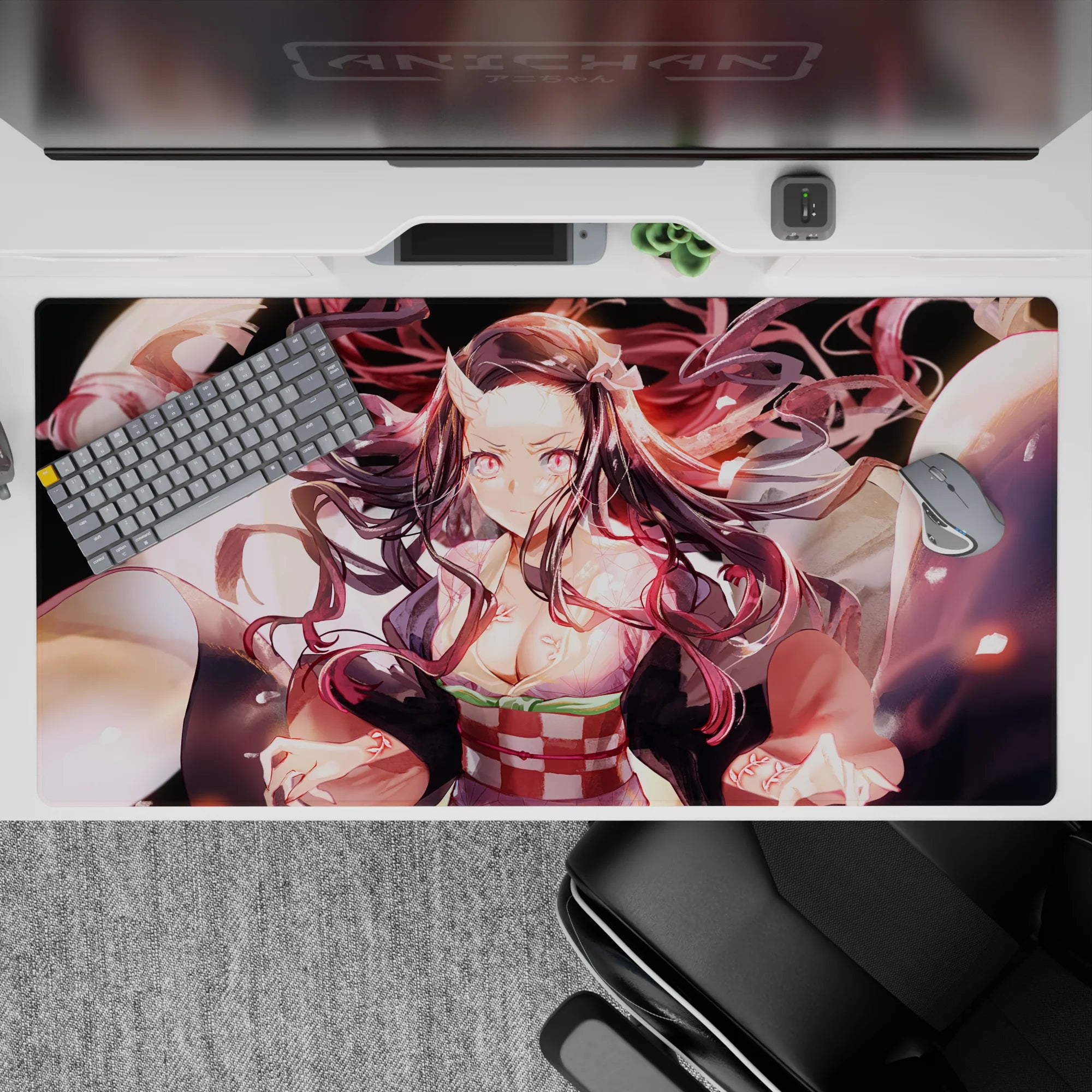 Nezuko Demon Slayer desk pad 40x20 inches featuring her radiant demon form with glowing pink eyes and swirling hair.