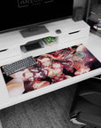 Nezuko in demon form on a 36x16 inch anime desk pad, capturing her transformation with glowing eyes and swirling hair from Demon Slayer.