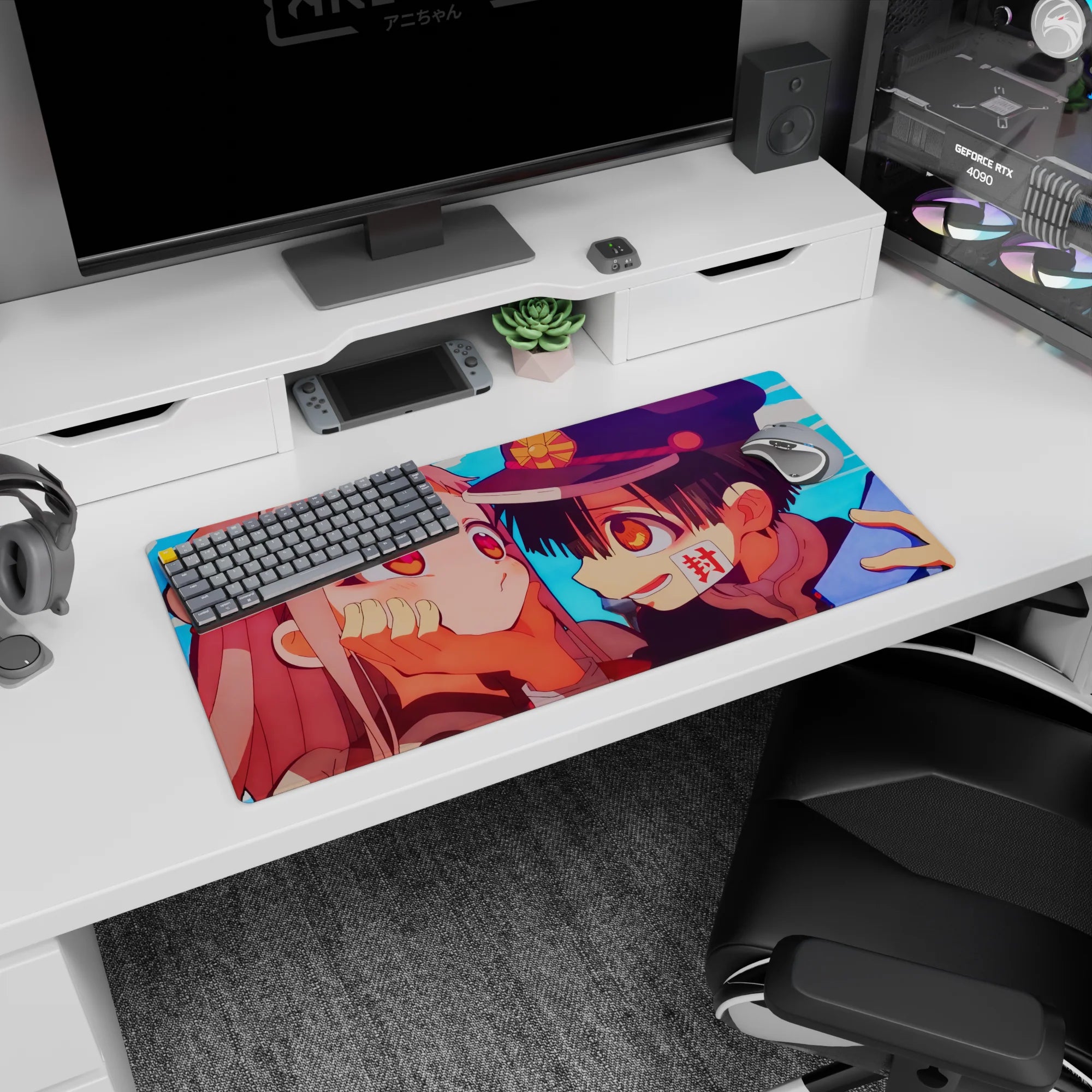 32x16 inches anime mouse pad showing grinning boy in dark cap cupping a shy pink-haired girl’s cheeks.