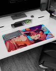 32x16 inches anime mouse pad showing grinning boy in dark cap cupping a shy pink-haired girl’s cheeks.