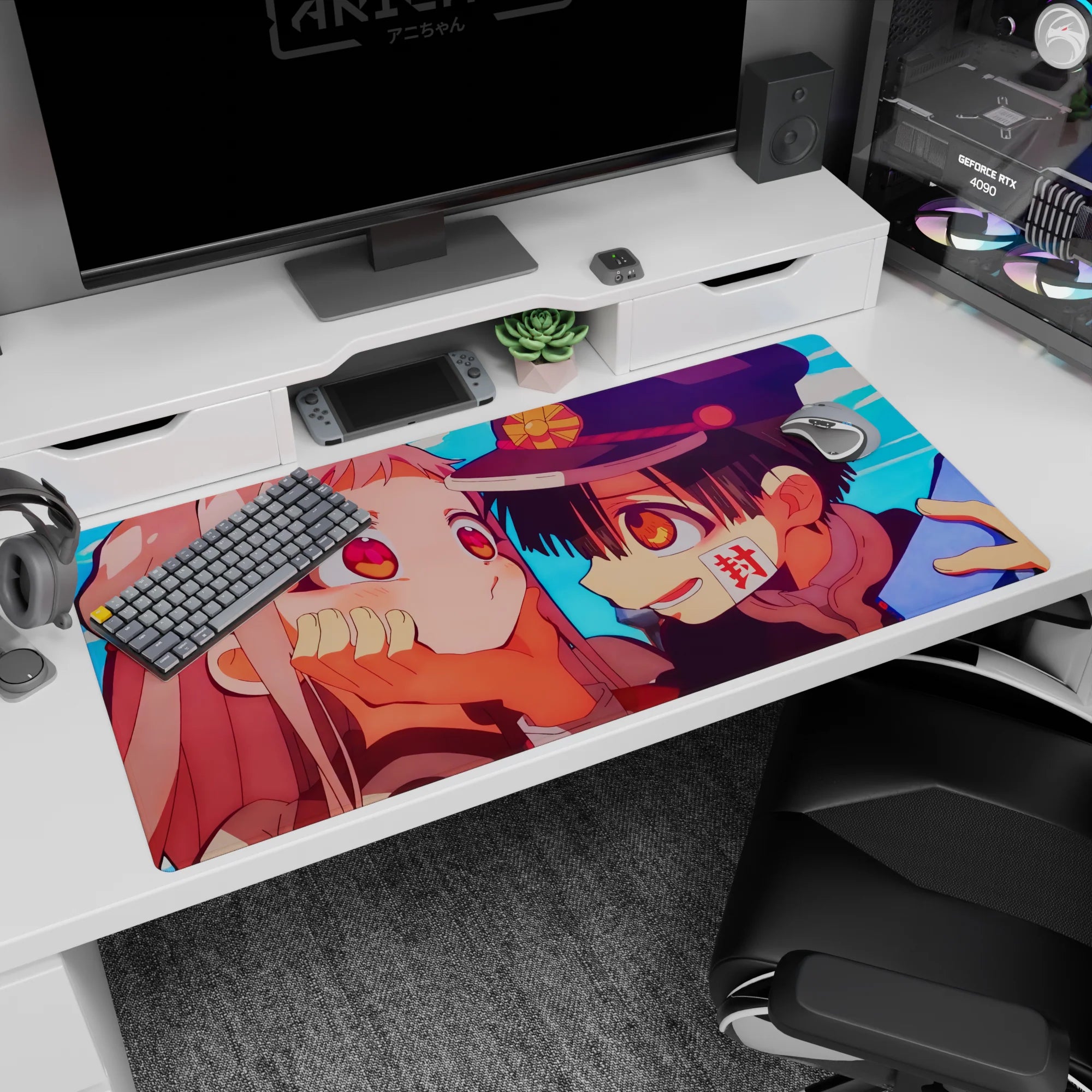 40x20 inches desk pad showing grinning cap-wearing boy leaning in, hands on pink-haired girl's cheeks.