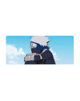 Anime mouse pad 28x12 inches featuring Kakashi Hatake from Naruto, under a serene sky with soft blues and whites.