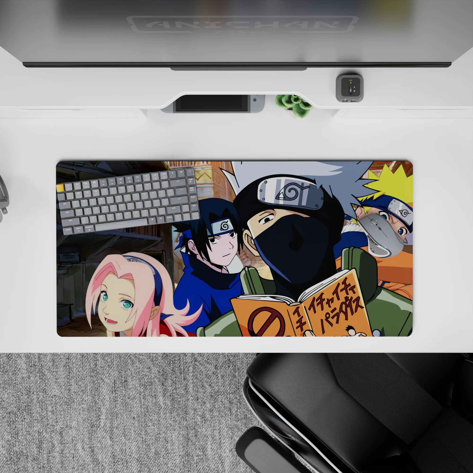 Anime mouse pad 32x16 inches featuring Team 7 from Naruto with Naruto, Sasuke, Sakura, and Kakashi on a village backdrop.