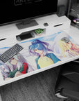 40x20 inches anime desk pad featuring blue ponytail girl in yellow-blue kanji jersey with calm stare.