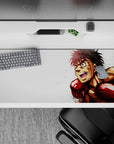 High-energy 36x16 inches anime desk pad in bold reds and warm tones on crisp white, action vibe.