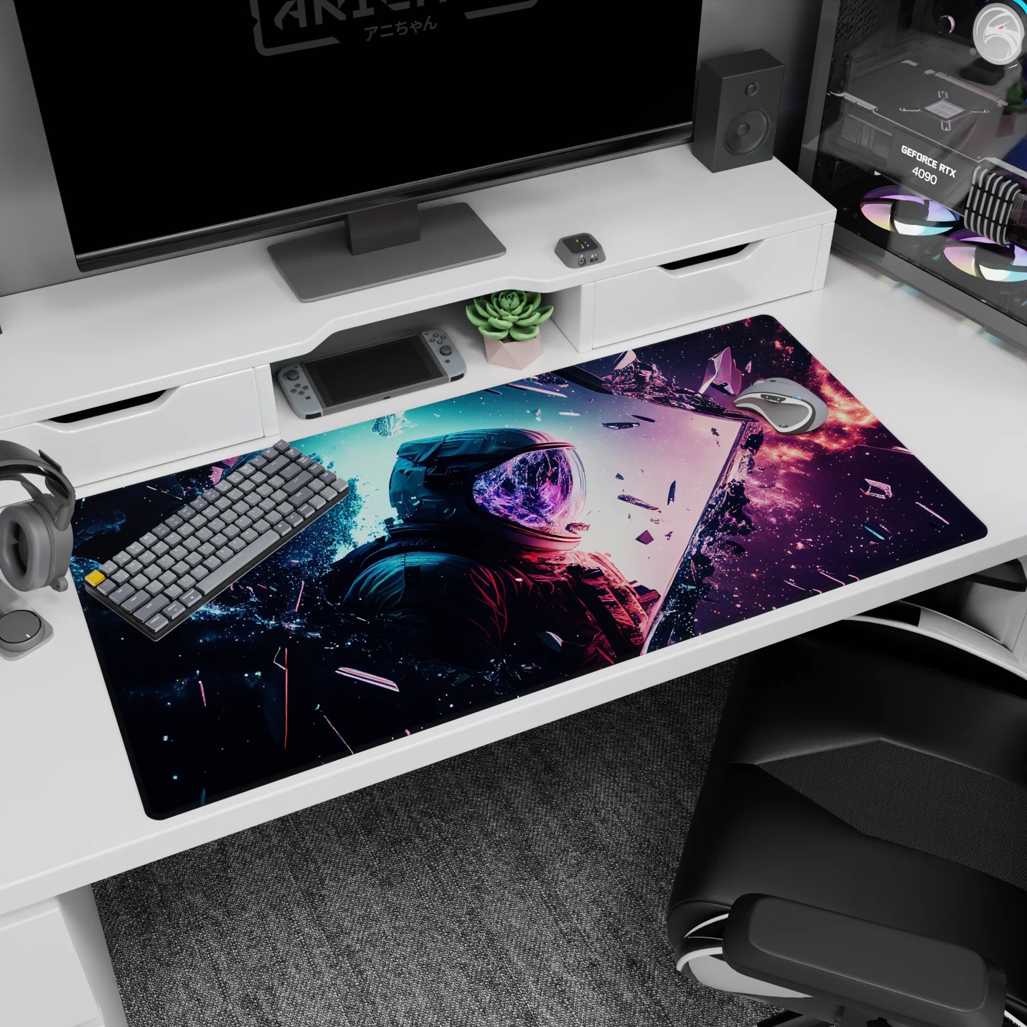 Cosmic desk pad 40x20 inches with nebula blues, smoky purples, coral glow, and astronaut silhouette.