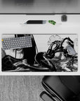 Smoky ink-wash noir anime desk mat 32x16 inches in black and gray haze with sharp glossy highlights.