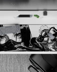 Smoky black-and-gray anime desk pad 36x16 inches, high-contrast noir haze with sharp highlights.