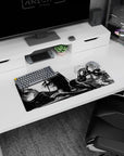 28x12 inches anime girl desk mat with long dark hair, teasing gaze, glossy leggings, hand near lips in armor.