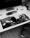 Anime girl lounges in sleek armor and glossy leggings on desk pad 36x16 inches, teasing gaze and attitude pose.