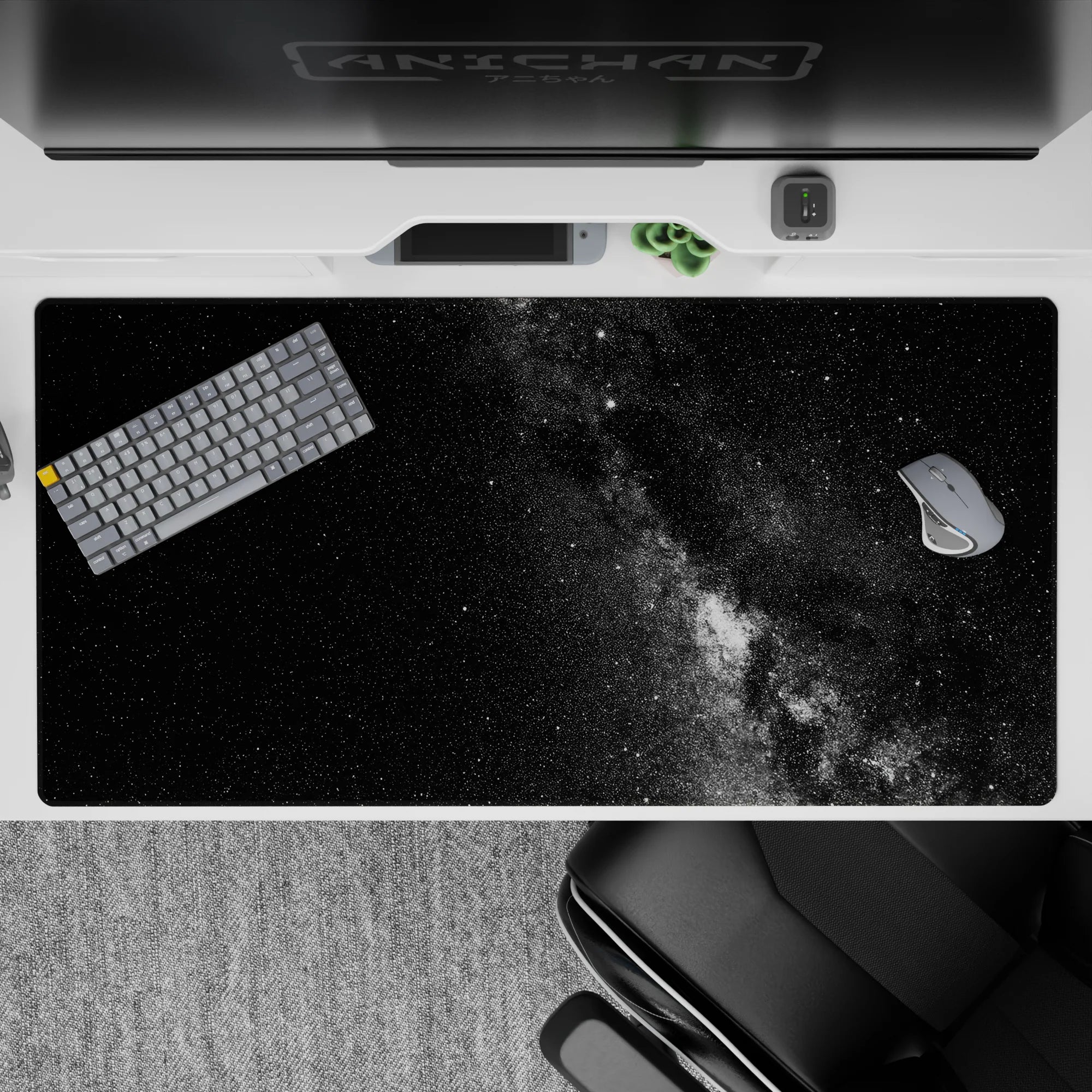 Large 40x20 inch desk pad with black and gray galaxy design, adding a calm and elegant touch to any workspace.