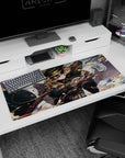 36x16 inches desk pad showing fierce anime officer girl mid-strike, curls flying, cape whipping, rifle wide.